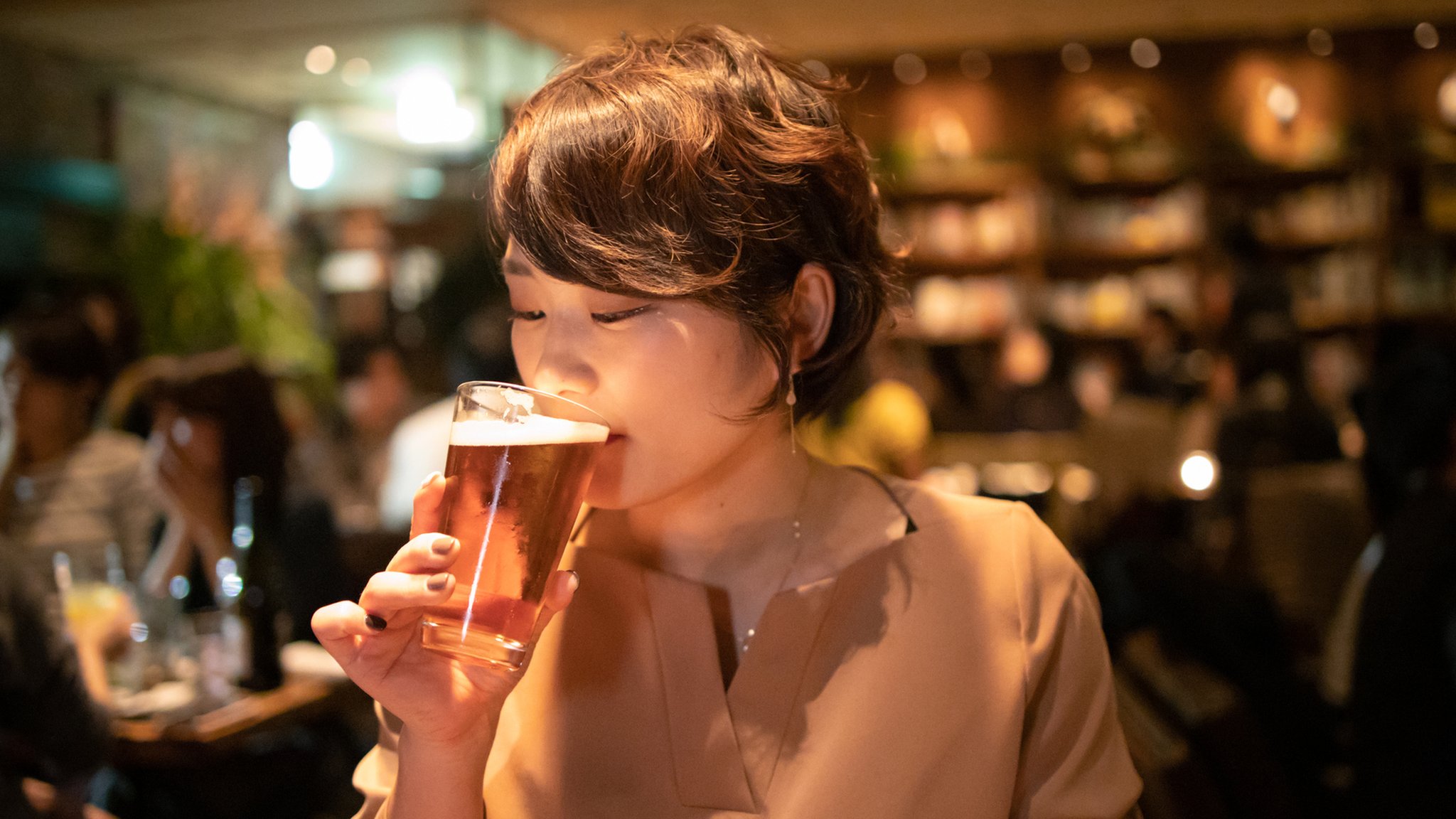 Japan urges its young people to drink more to boost economy photo
