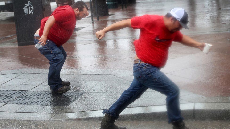 Workers in New Orleans battle winds