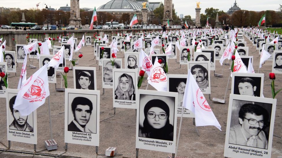 Some 800 portraits of political prisoners who were executed in Iran in 1988 after displayed by representatives in France of the People's Mujahedin Organisation of Iran on the Esplanade des Invalides in Paris (29 October 2019)