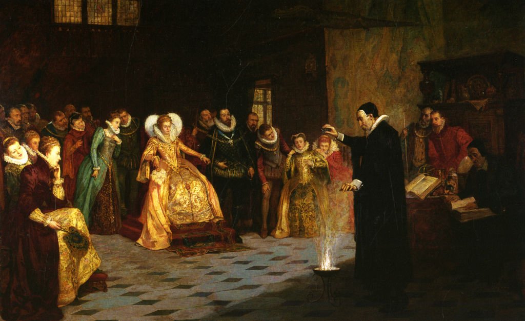John Dee realizando un experimento frente a Isabel I combinando químicos para producir una reacción.