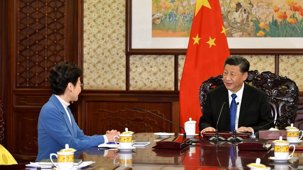 A handout photo made available by Hong Kong Government"s Information Services Department (ISD) shows Hong Kong Chief Executive Carrie Lam (L) with Chinese President Xi Jinping (R) during their meeting in Beijing, China, 16 December 2019