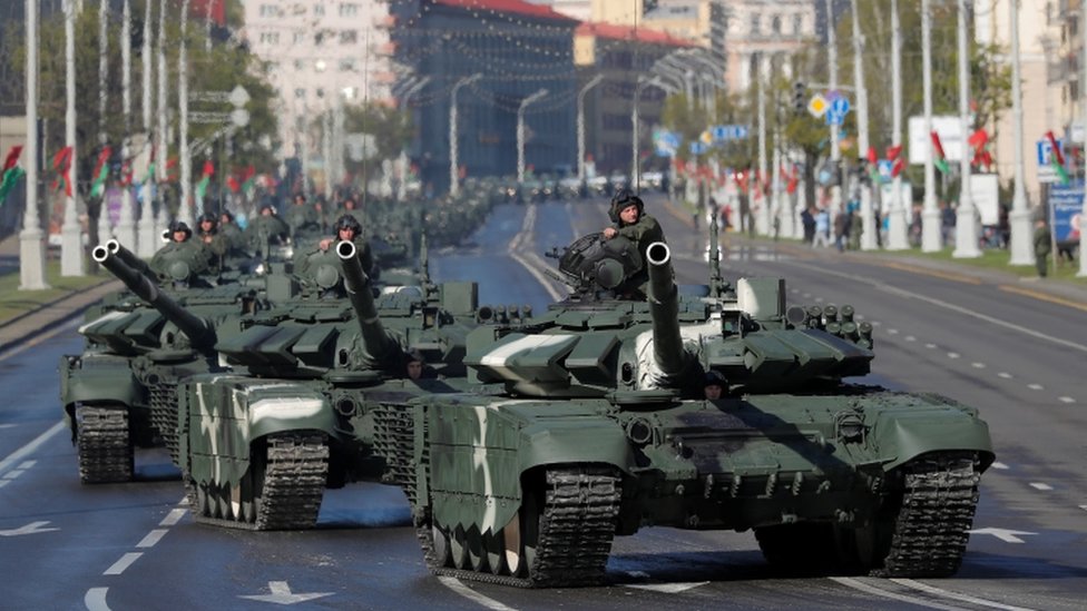 Belarusian servicemen drive tanks along the street before a rehearsal for the Victory Day parade on 8 May