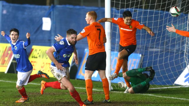 Mark Stafford heads in Linfield's second goal against Carrick Rangers