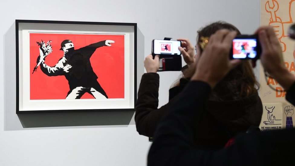 Banksy was warned about website flaw before NFT hack scam - BBC News