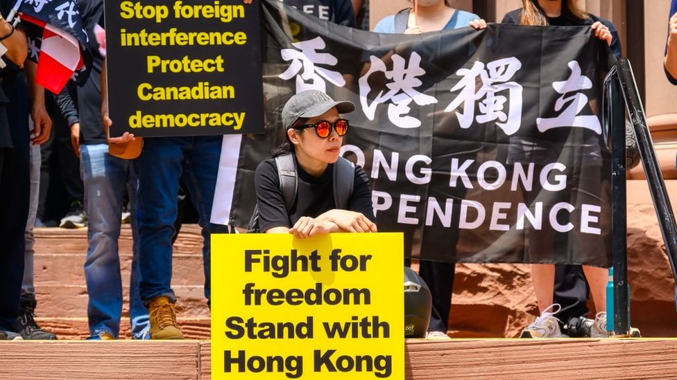People protesting against Foreign Interference in Canada. They are also standing in solidarity with Hong Kong's independence