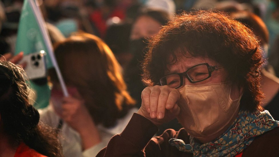 Supporters of Chen Shih-chung, Democratic Progressive Party (DPP) candidate cry after he concedes in the mayoral election in Taipei, Taiwan, November 26, 2022.