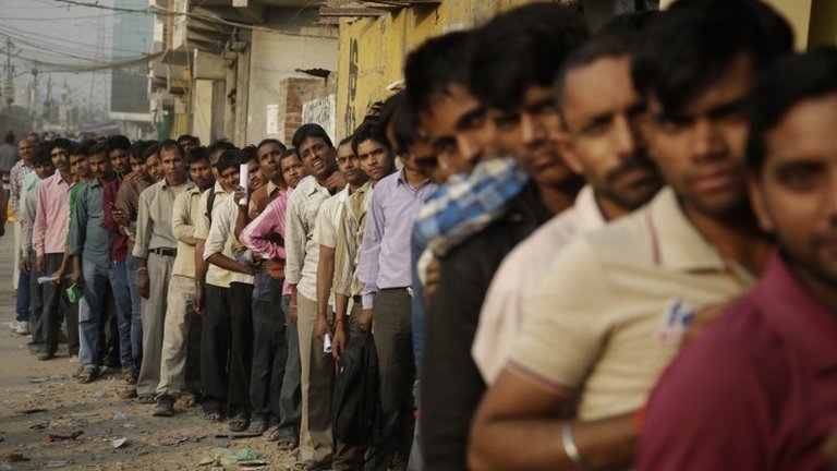 Cash for queues: people paid to stand in line amid India's bank note crisis, India