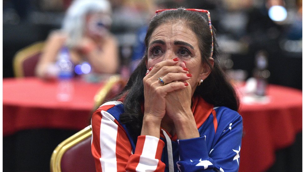 A voter in Las Vegas, Nevada, watches on anxiously for the latest count