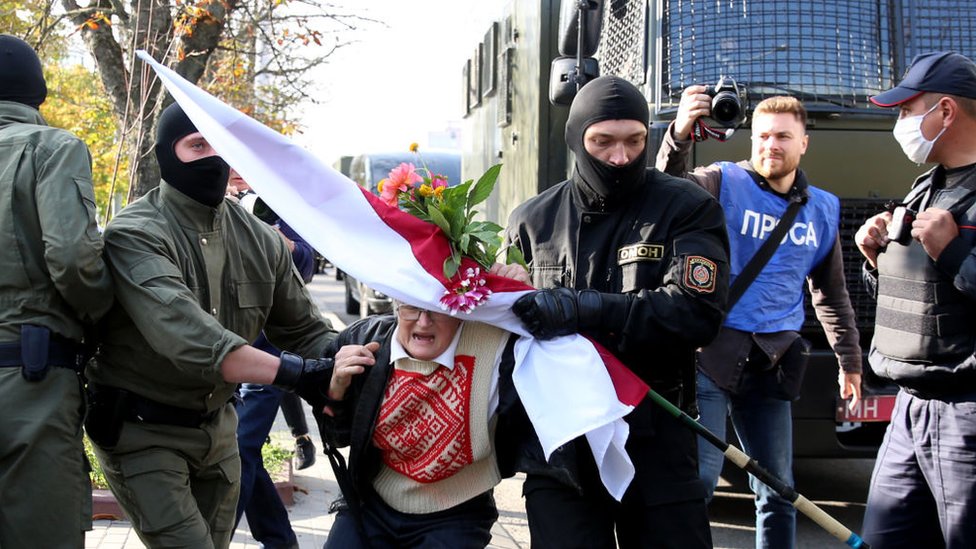 Law enforcement officers detain an opposition activist Nina Baginskaya