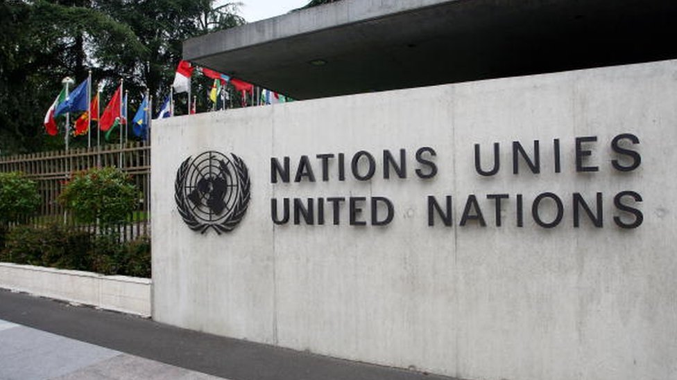 The United Nations emblem is seen in front of the United Nations Office in Geneva, Switzerland