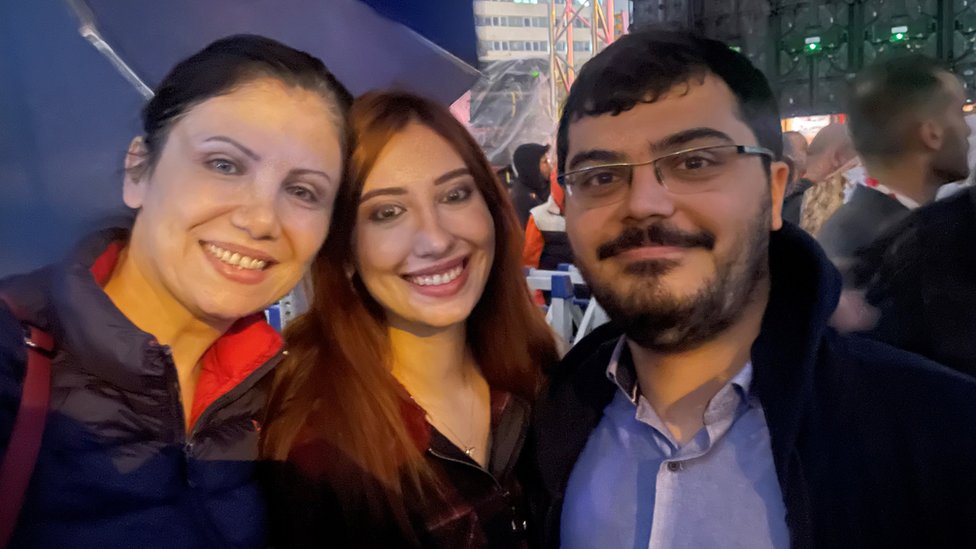 Firat (R) with his sister and mother
