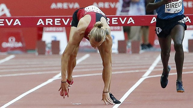 Evan Jager falls after the final hurdle in the 3,000m steeplechase in Paris