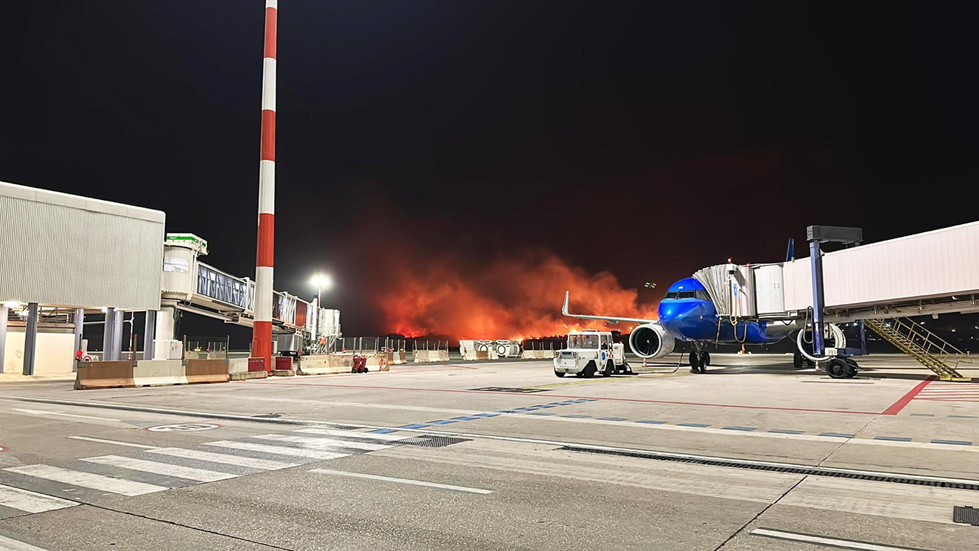 ​​Flames from wildfires are seen near the Falcone Borsellino Airport in Palermo, Italy - 25 July 2023