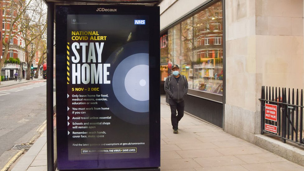 bus stop poster reading stay home