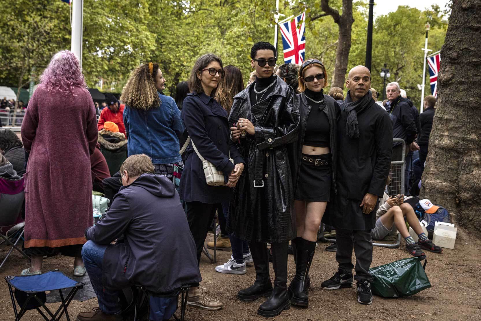 Some people pose for a photo on The Mall