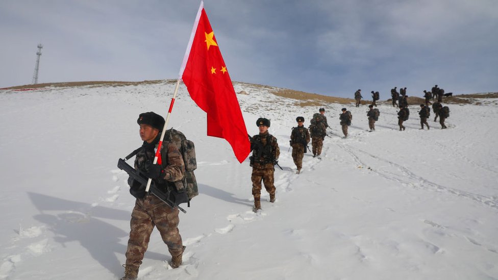 Chinese troops march through the snow in Xinjiang