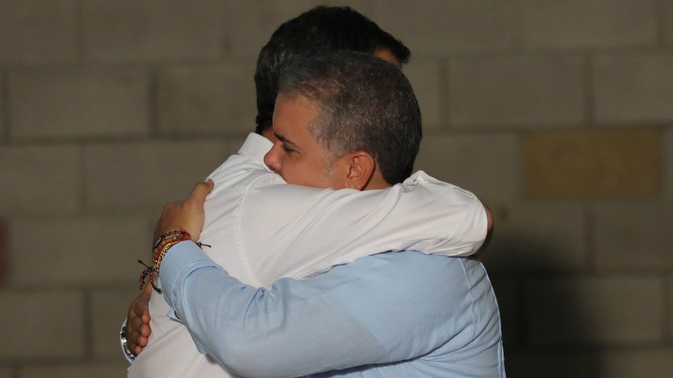 Guaidó embraces Colombia's President Ivan Duque