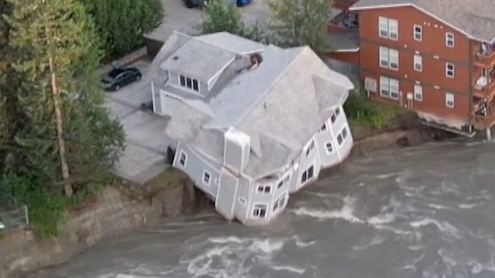 Alaska: Moment house collapses into river during flood