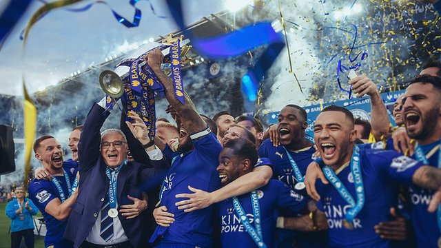 Leicester captain Wes Morgan and manager Claudio Ranieri lift the Premier League trophy
