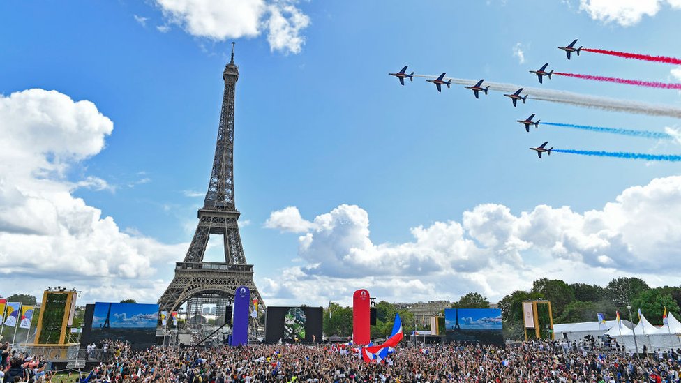 Paris marked the delivery of the Olympic flag with aerobatics.