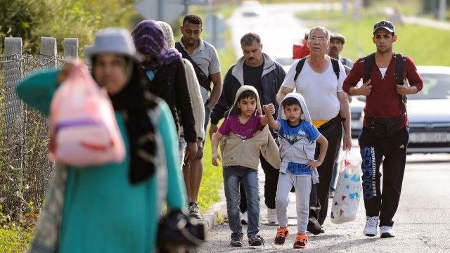Migrants walk on the Croatian side of the Slovenska vas-Bregana border crossing between Croatia and Slovenia