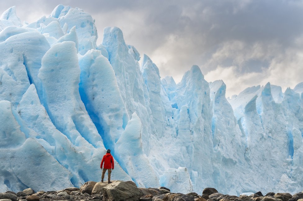 Person staring at glacier in Argentina