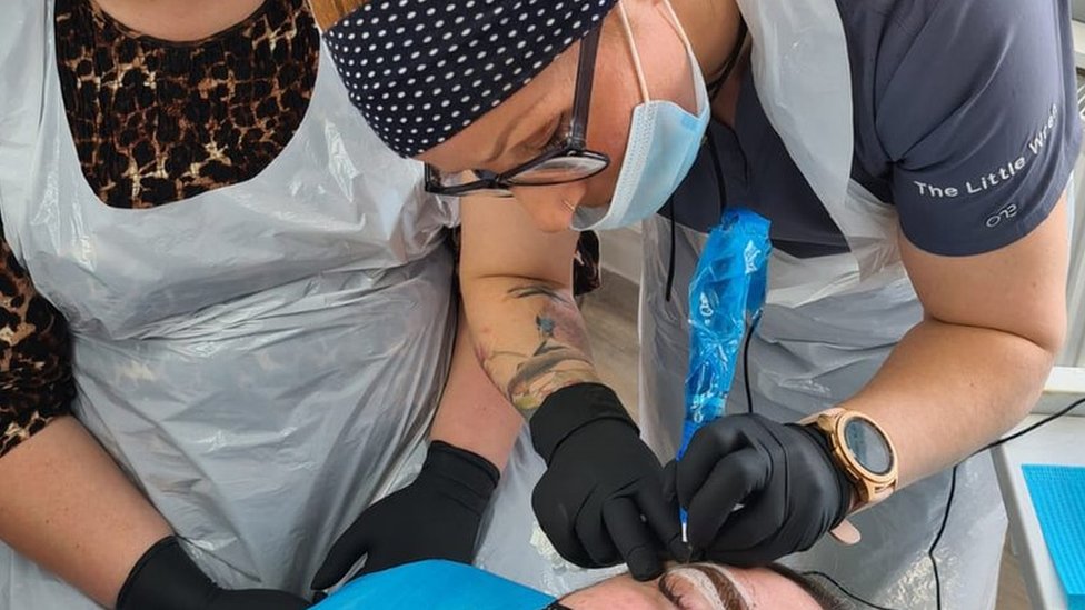 Stricter rules for tattoos and piercings in Wales - BBC News
