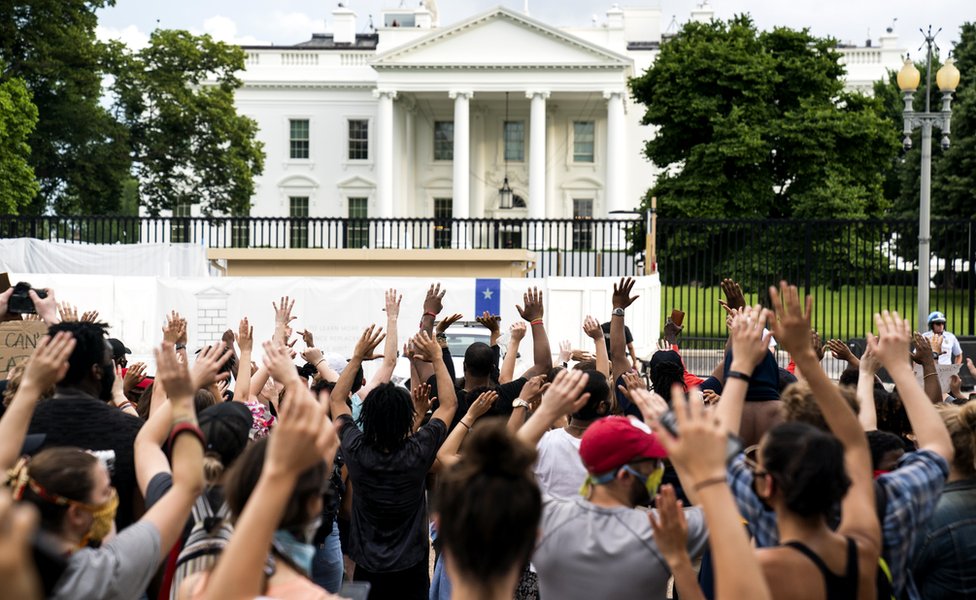 People gather outside the White House during a protest over the Minneapolis, Minnesota, arrest of George Floyd, who later died in police custody, 29 May 2020