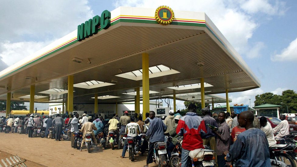 Motorcyclists wey queue for fuel inside goment filling station for Abuja