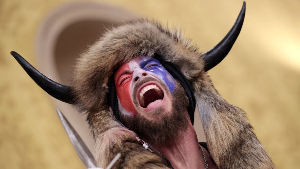 A Trump supporter wears face paint at a protest in Washington, DC