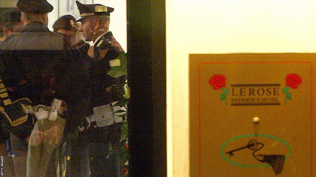 Italian police in the Residence Le Rose hotel lobby after Marco Pantani's body was found