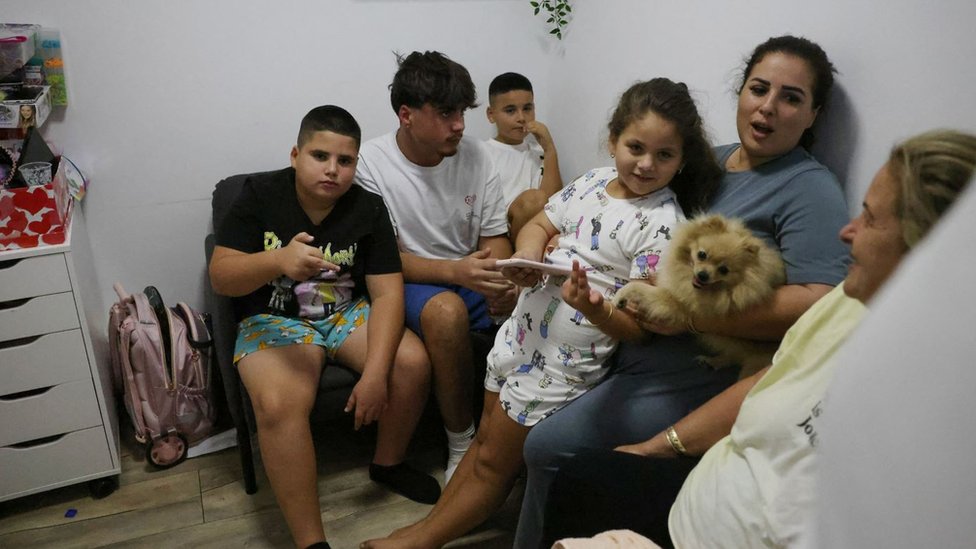 An Israeli family take shelter in a basement in the southern city of Ashkelon