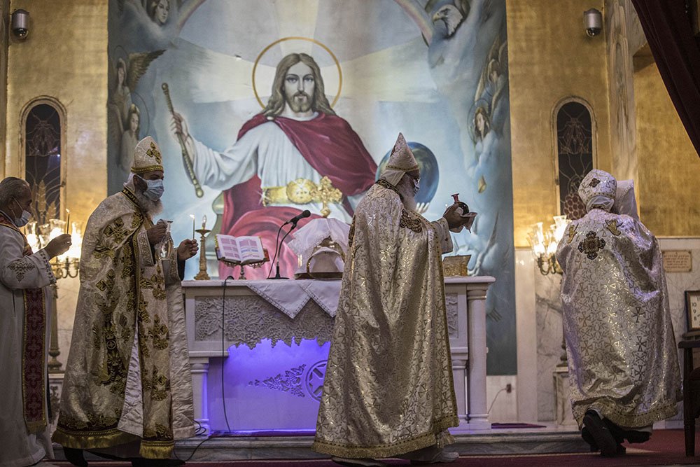 Egyptian Coptic Priests lead the Christmas Mass at the Archangel Michael Coptic Orthodox Church in Cairo