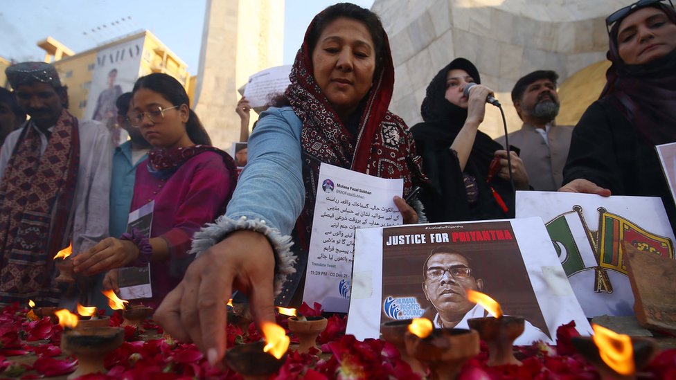 People in Pakistan hold a vigil for Priyantha Diyawadanage on Sunday in protest of his violent mob death