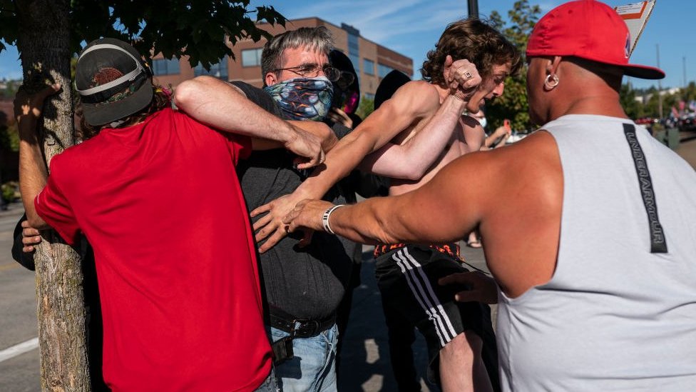 Black Lives Matter protester scuffles with Trump supporter in Portland, 29 August 2020