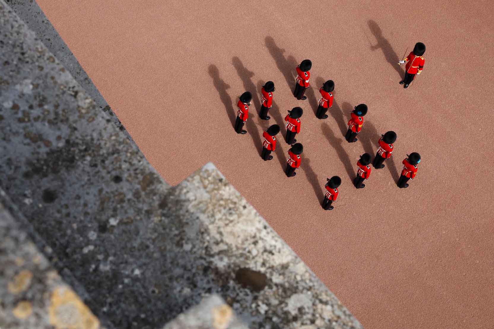 Grenadier guards stand to attention.