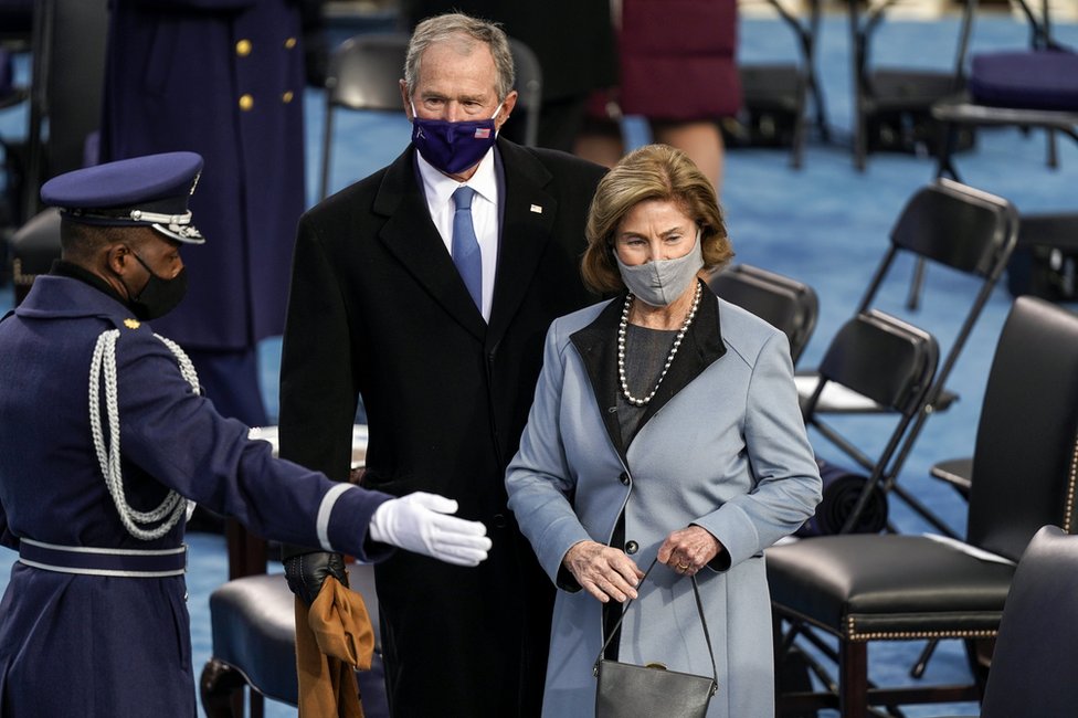 Former President George W. Bush and former First Lady Laura Bush are shown their seats