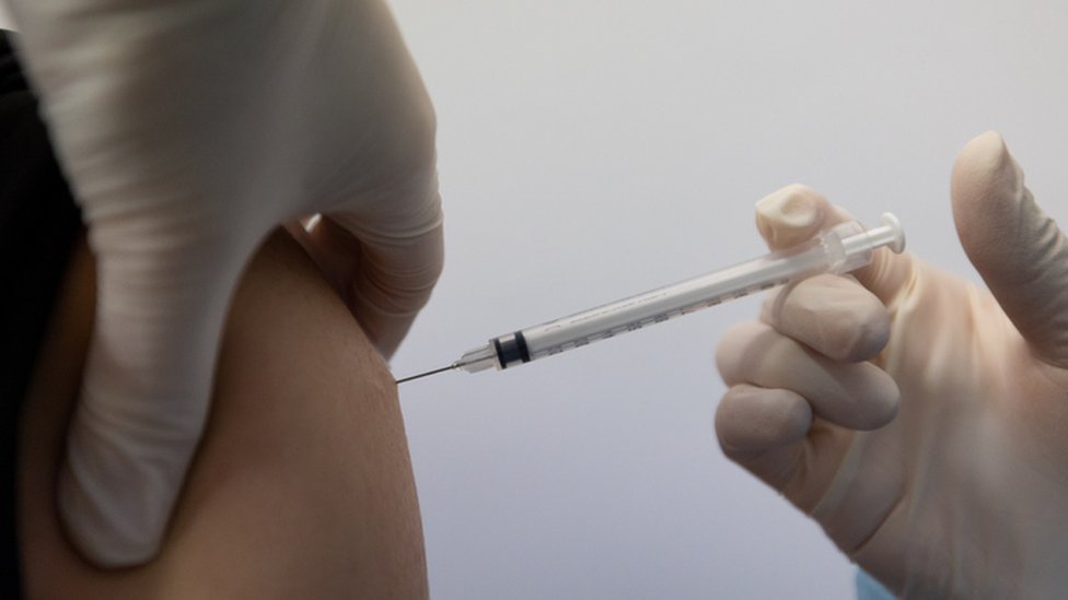Vaccine being applied in an unidentified person