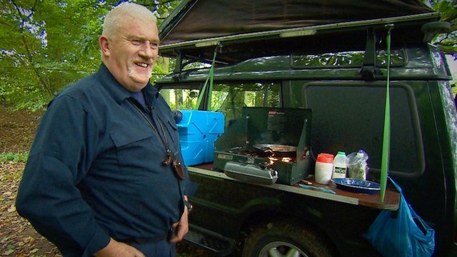 Michael Sanderson cooks food from a hob attached to the side of his car