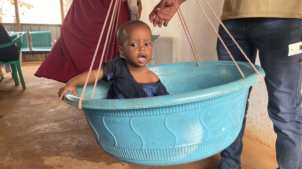 Baby being weighed