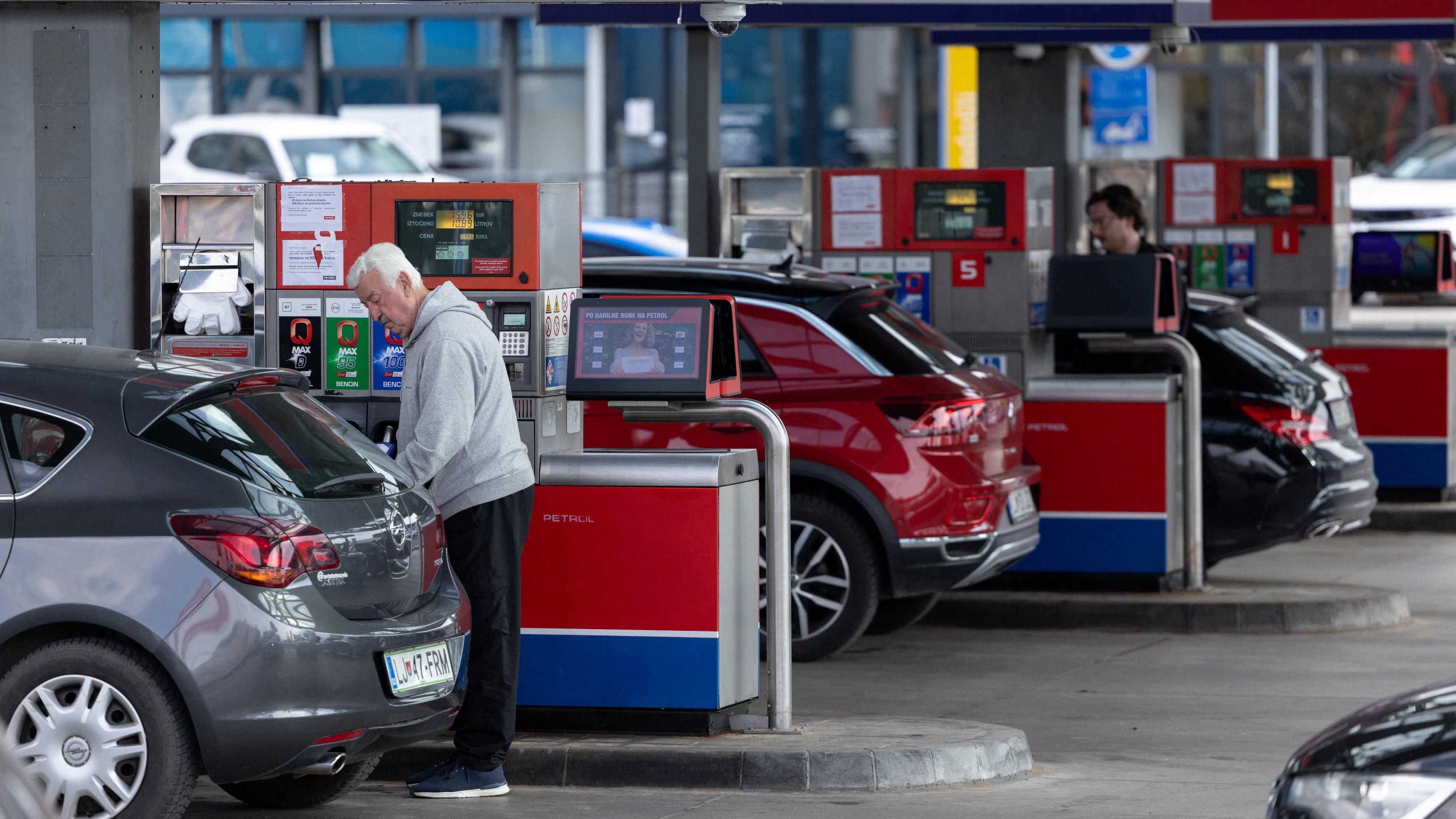 Cars line up at a petrol station in Slovenia after the government imposed fuel rationing.