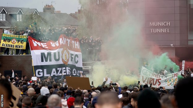 Manchester United fans protest outside Old Trafford against the club's ownership under the Glazer family