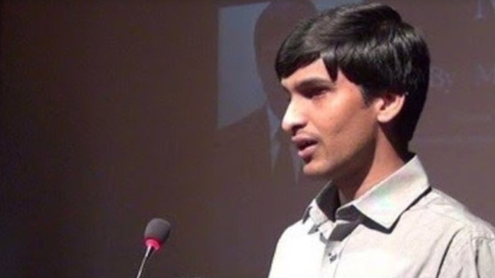 Srikanth Bolla standing in front of a microphone