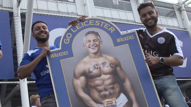 Fans with a mock-up of Gary Lineker