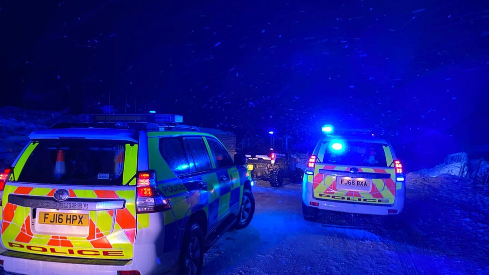 Motorists being rescued in the snow