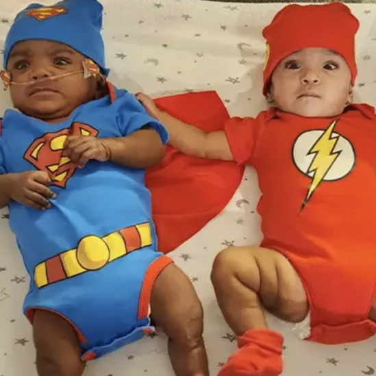 The kids in superhero costumes