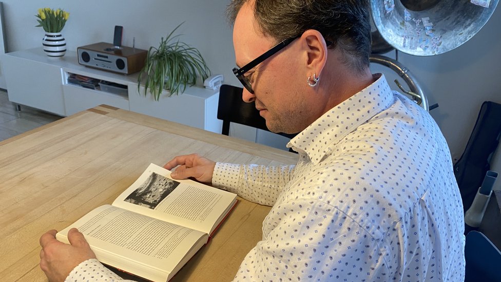 Swiss historian Martin Bucher reads one of his books