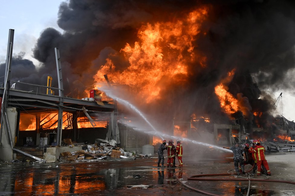 Lebanese firefighters try to extinguish a fire
