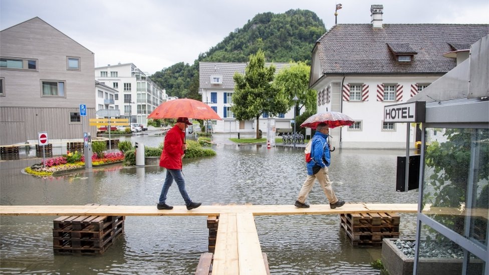A village on Lake Lucerne is covered with flood water, in Stansstad, Switzerland, 15 July 2021