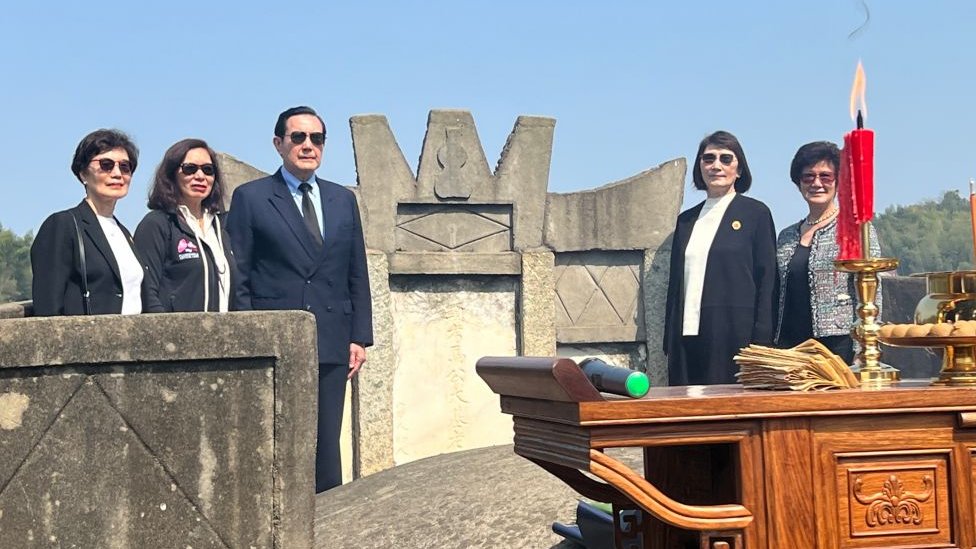 Ma Ying-jeou and his sisters pose at the tomb of his grandfather on April 1, 2023 in Hunan Province.
